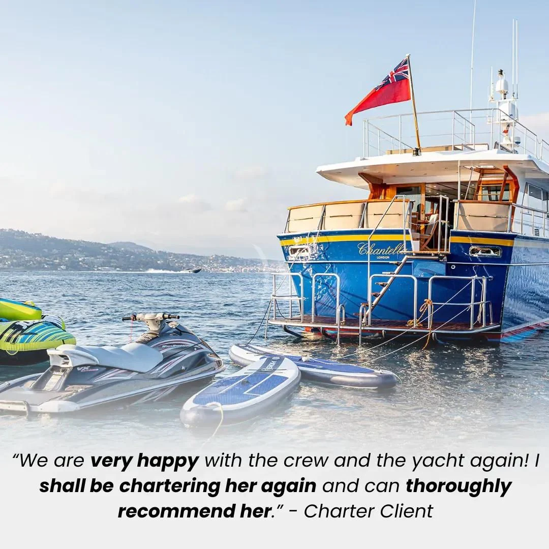 a boat with a flag on it aboard CHANTELLA Yacht for Sale