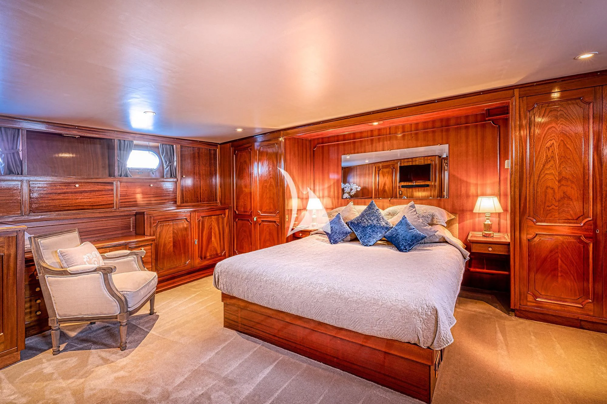 a large bedroom with a large bed aboard CHANTELLA Yacht for Sale