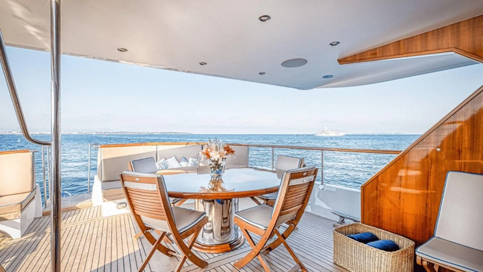 a table and chairs on a balcony aboard CHANTELLA Yacht for Sale
