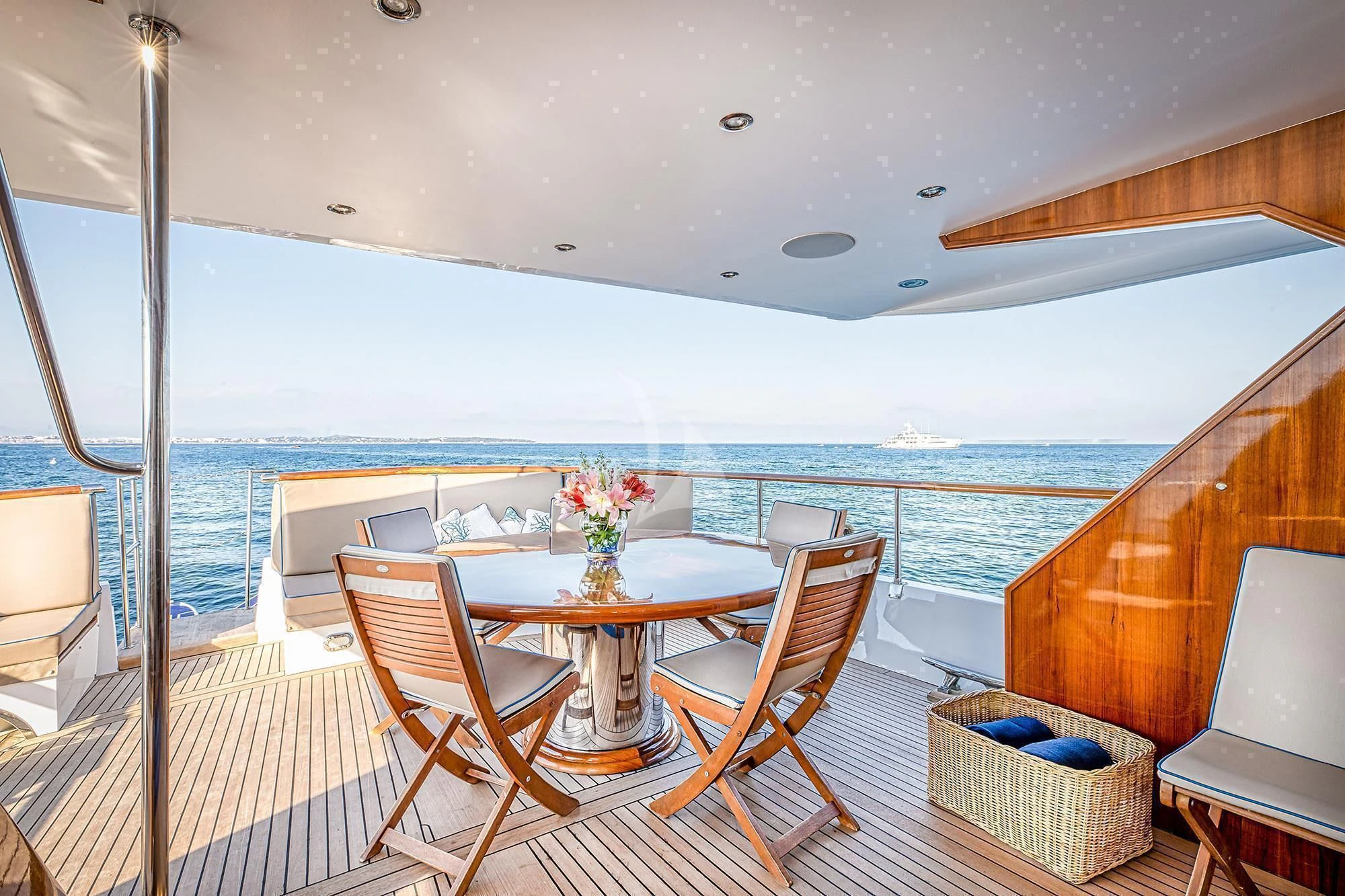 a room with a table chairs and a view of the ocean aboard CHANTELLA Yacht for Sale