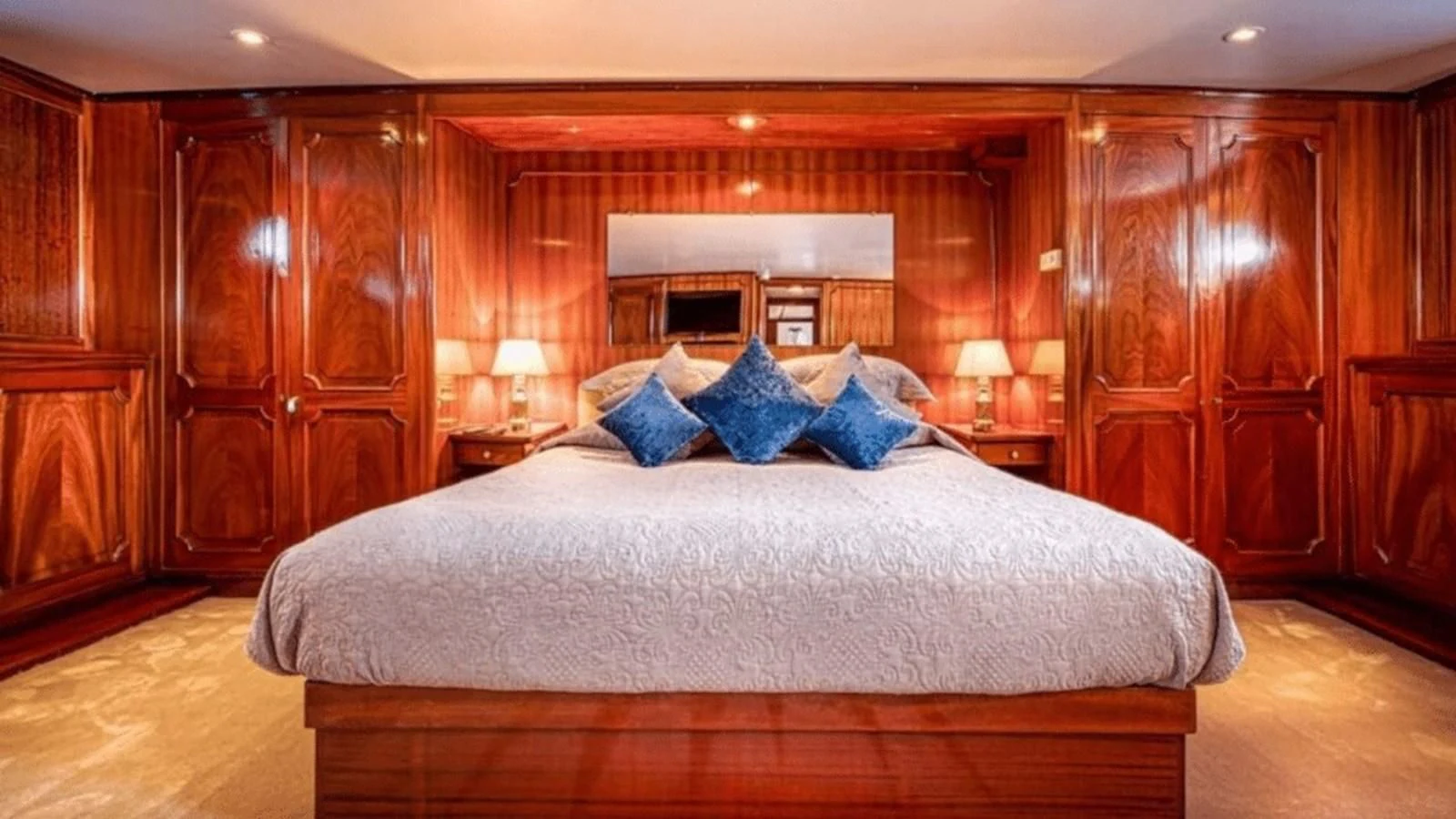 a large bed in a room aboard CHANTELLA Yacht for Sale