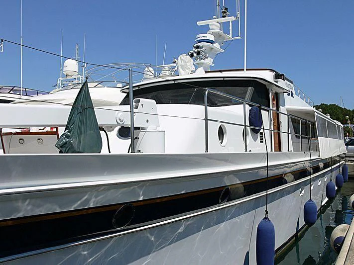 a white boat with blue and green decorations aboard CHANTELLA Yacht for Sale