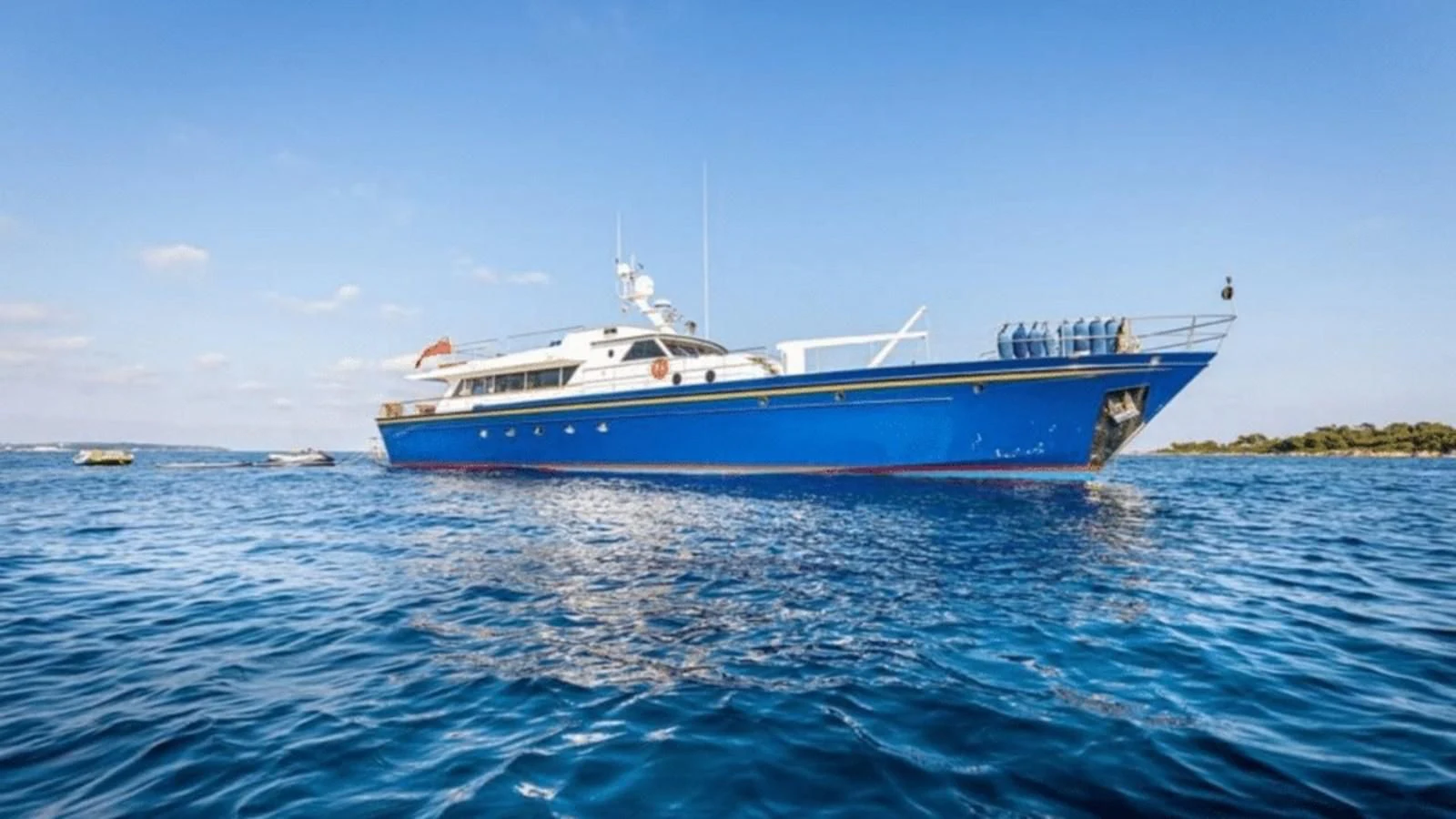 a large boat in the water aboard CHANTELLA Yacht for Sale