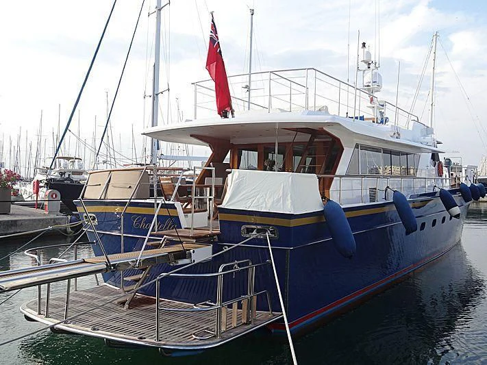 a boat docked at a pier aboard CHANTELLA Yacht for Sale