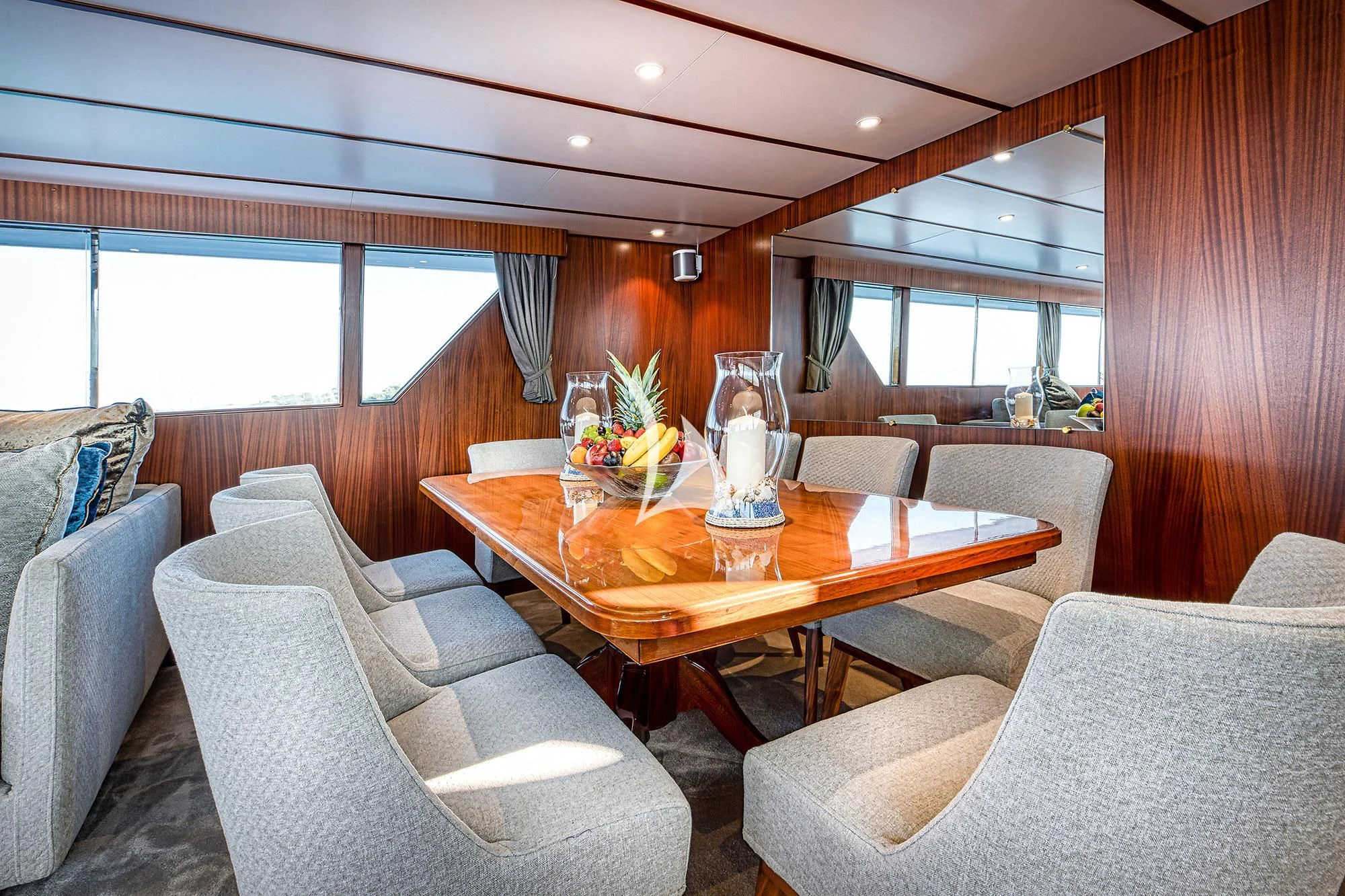 a room with a table chairs and a window aboard CHANTELLA Yacht for Sale
