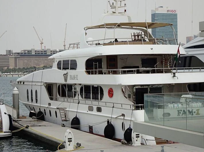 a white boat docked aboard OCEAN QUEEN Yacht for Sale