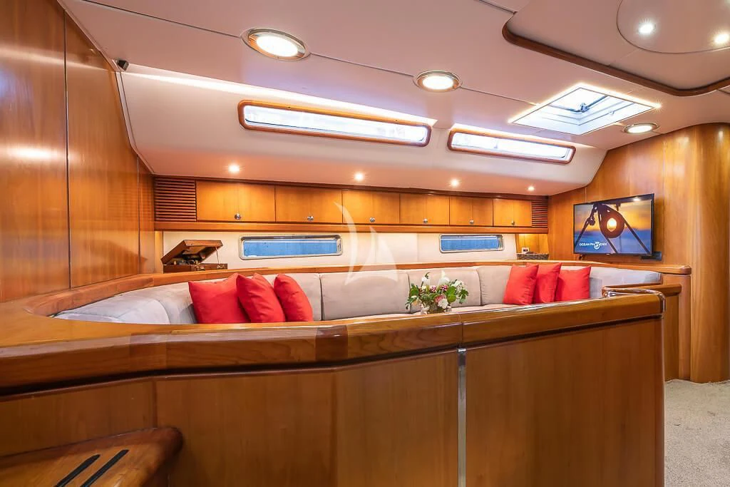 a room with a bed and a television aboard OCEAN PHOENIX Yacht for Sale