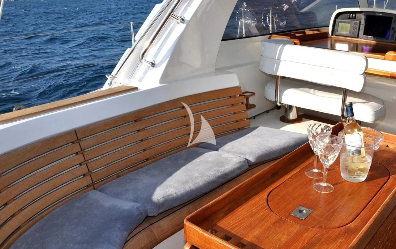 a boat with a table and glasses on it aboard OCEAN PHOENIX Yacht for Sale