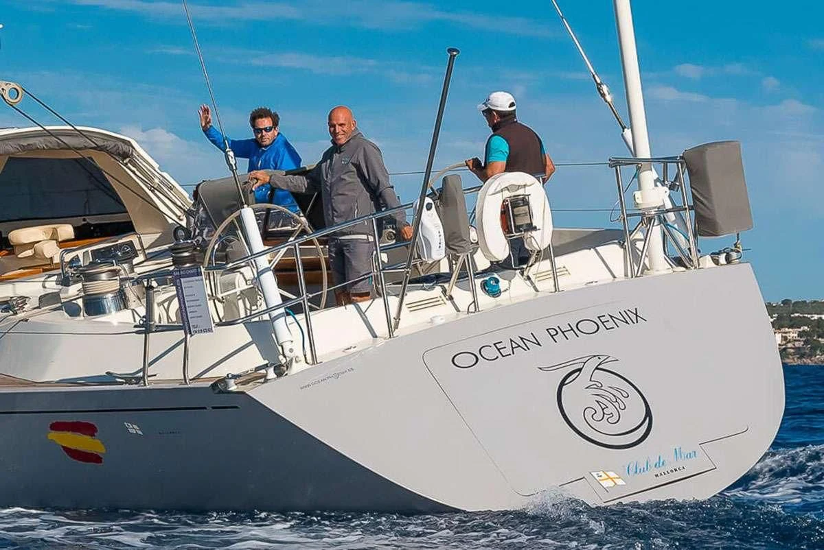 a group of men on a boat aboard OCEAN PHOENIX Yacht for Sale
