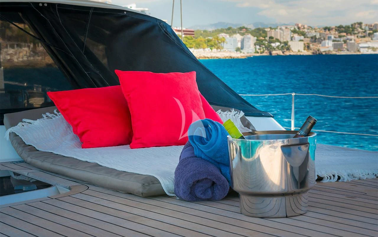 a boat with a red and white umbrella on it aboard OCEAN PHOENIX Yacht for Sale
