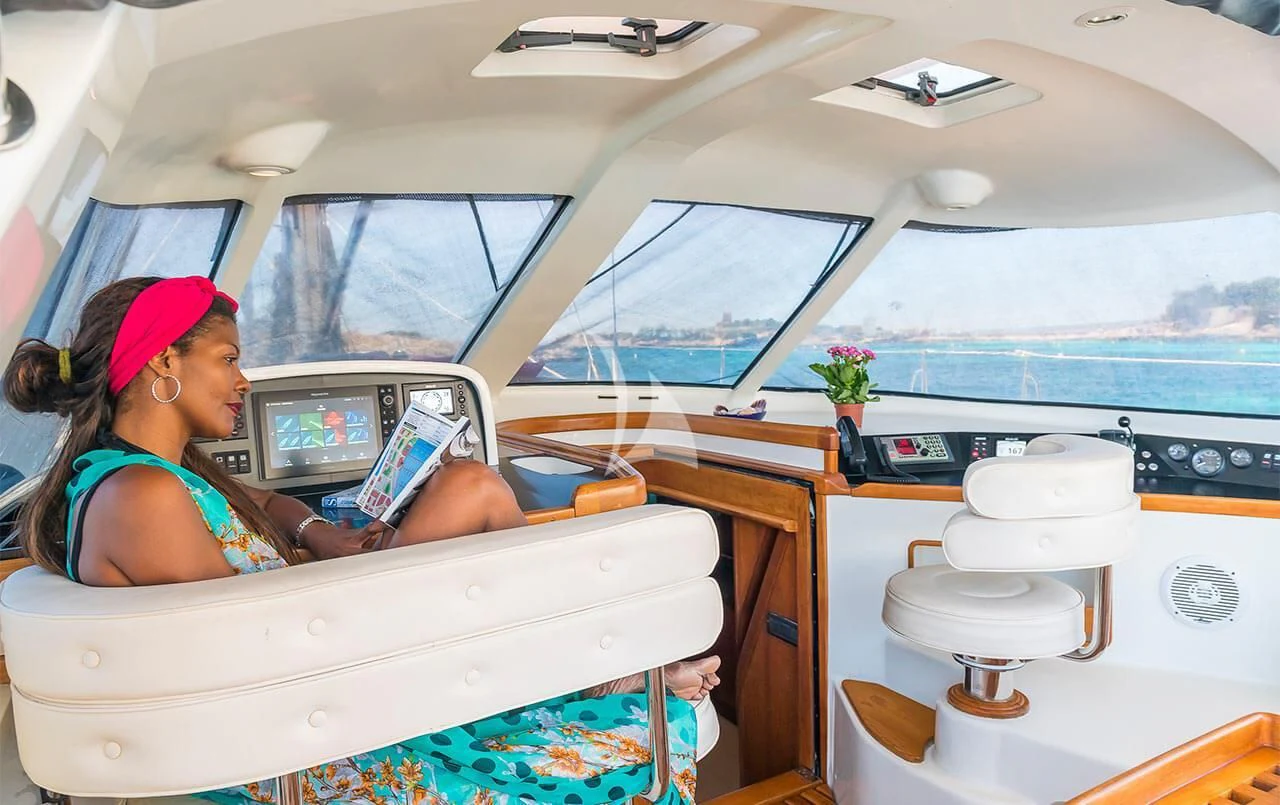 a person in a car aboard OCEAN PHOENIX Yacht for Sale