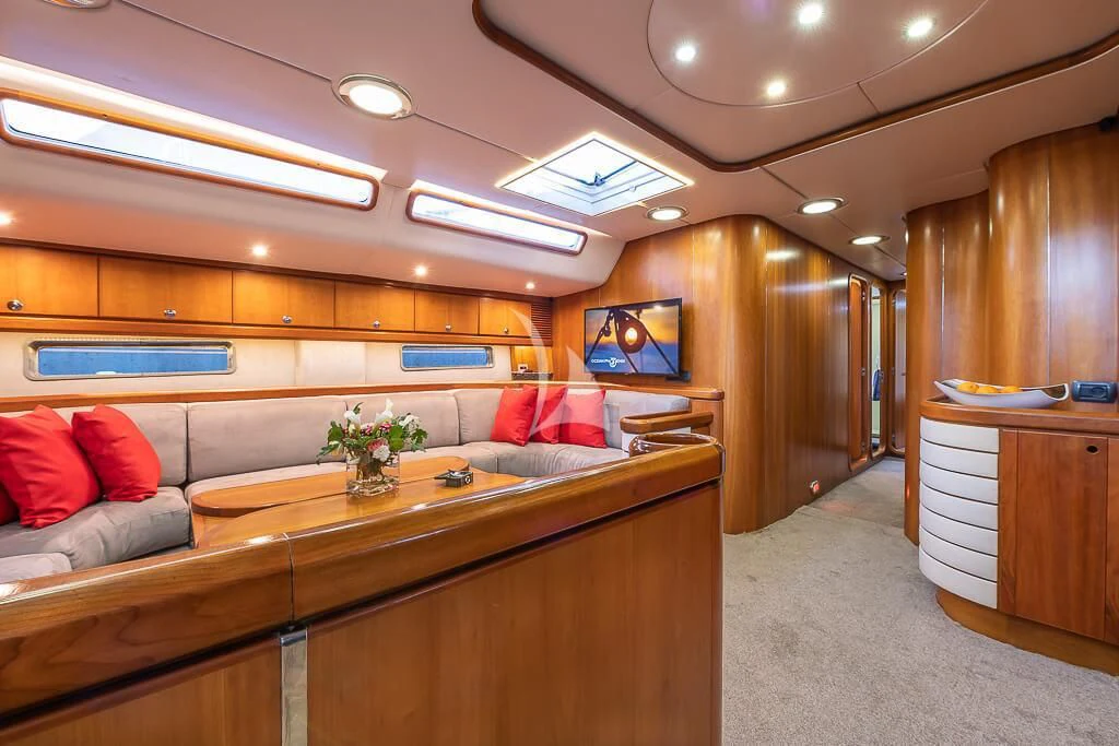 a room with a couch and a desk aboard OCEAN PHOENIX Yacht for Sale