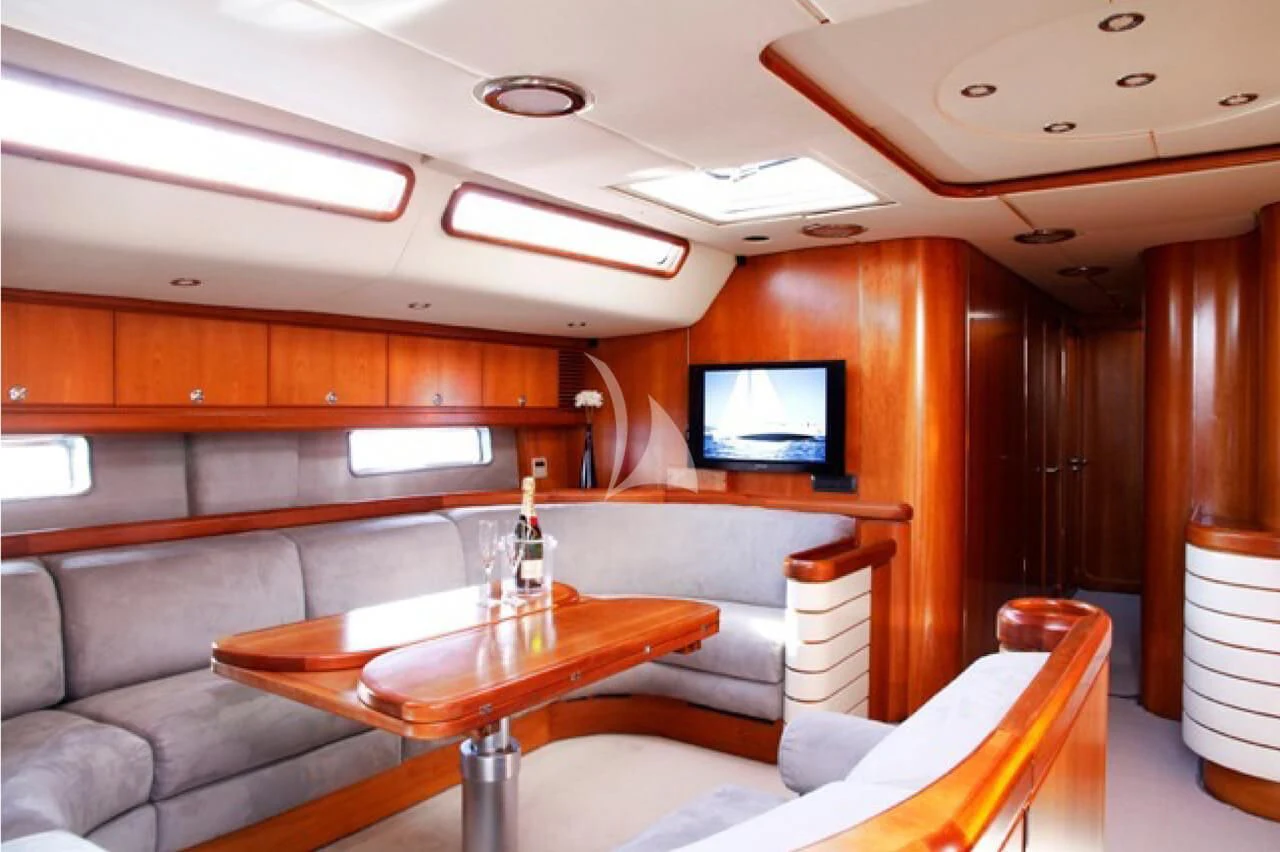 a room with a couch and a television aboard OCEAN PHOENIX Yacht for Sale