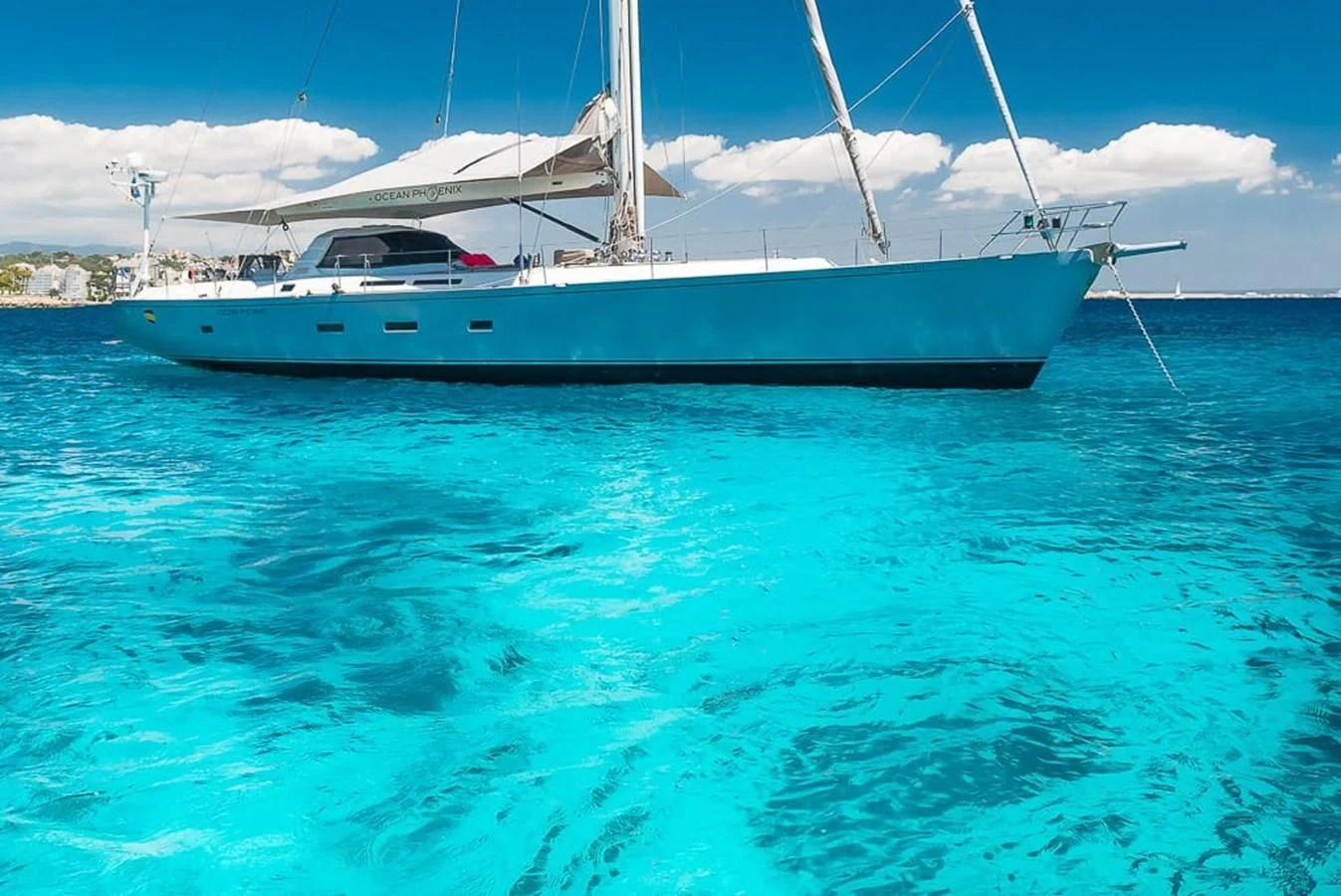 a boat in the water aboard OCEAN PHOENIX Yacht for Sale