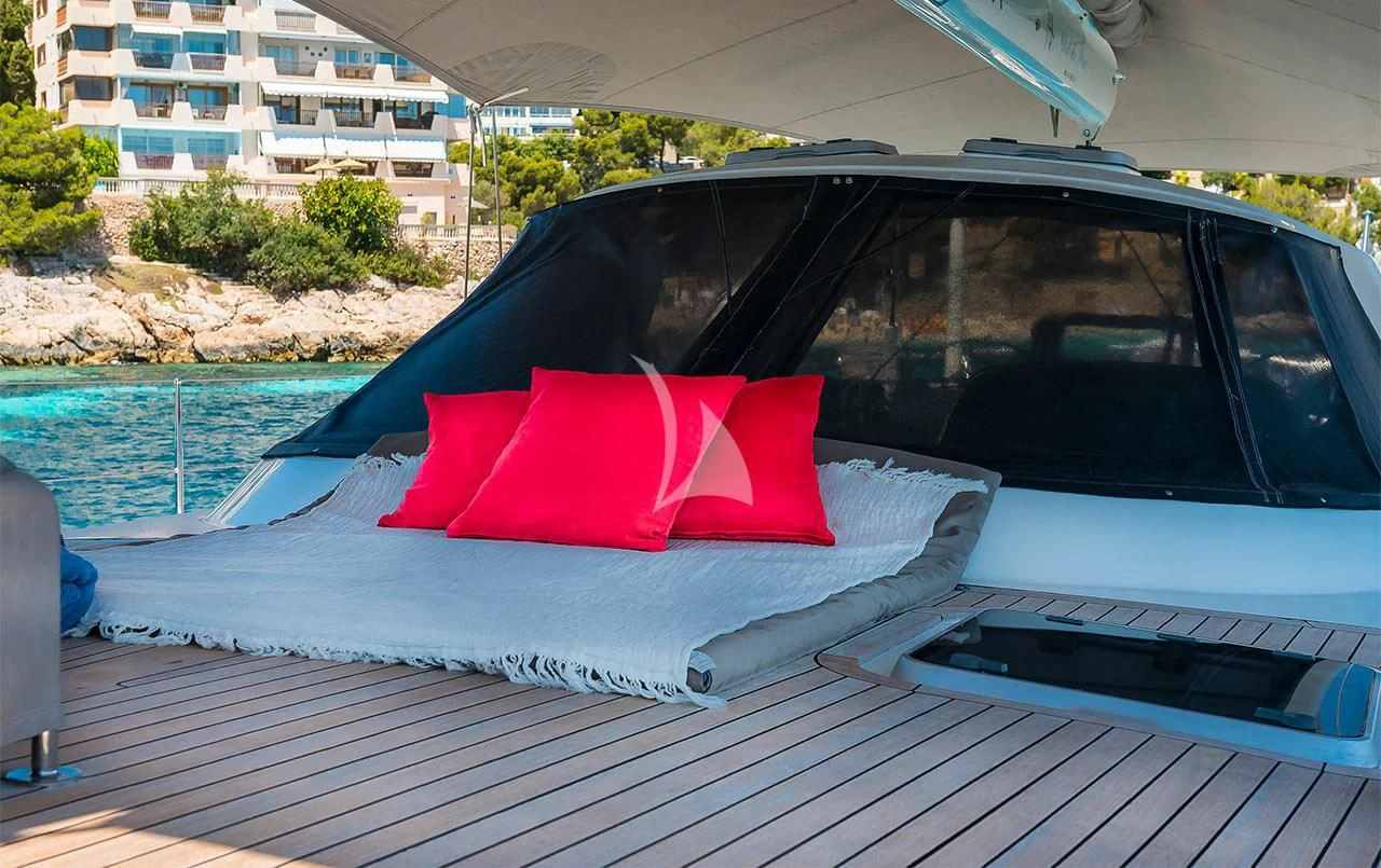 a red umbrella on a car aboard OCEAN PHOENIX Yacht for Sale
