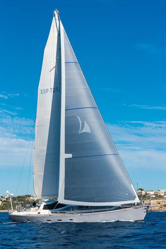 a white sailboat on the water aboard OCEAN PHOENIX Yacht for Sale