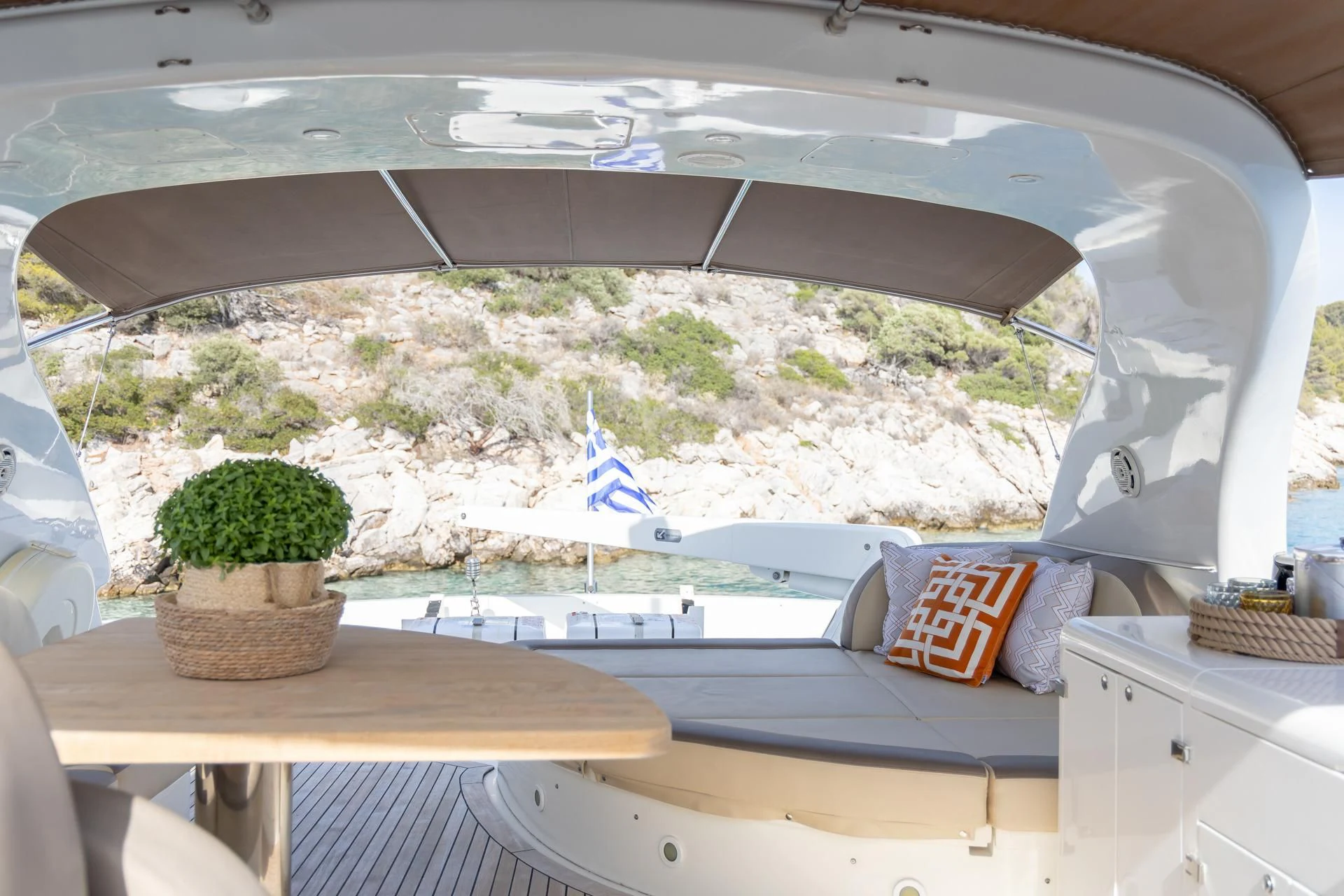a tent with a view of a lake and trees aboard COOKIE Yacht for Charter
