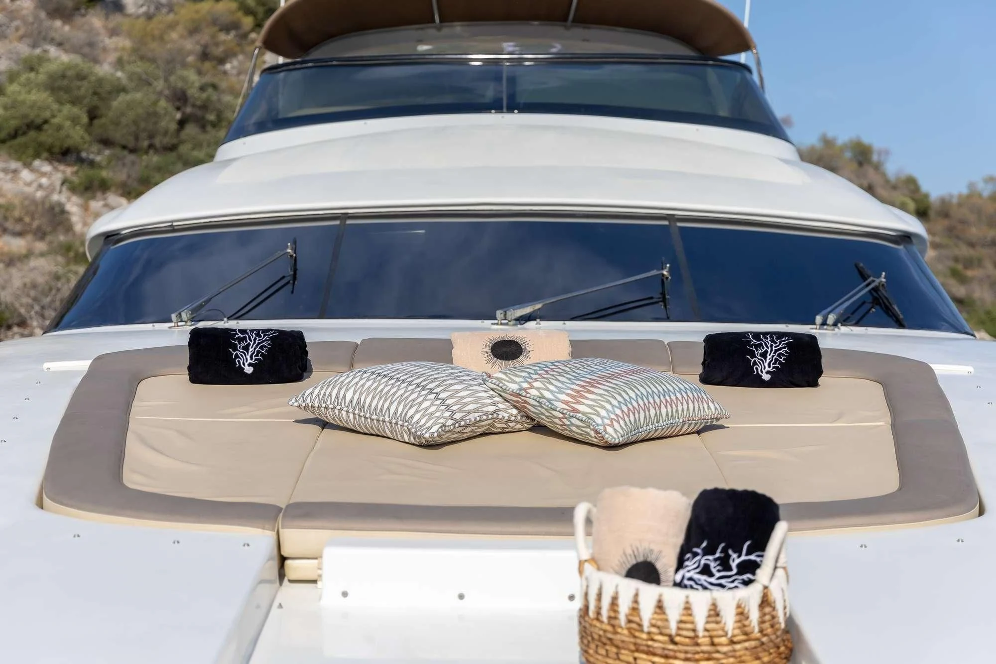 a white car with a large white roof and a basket with pillows aboard COOKIE Yacht for Charter