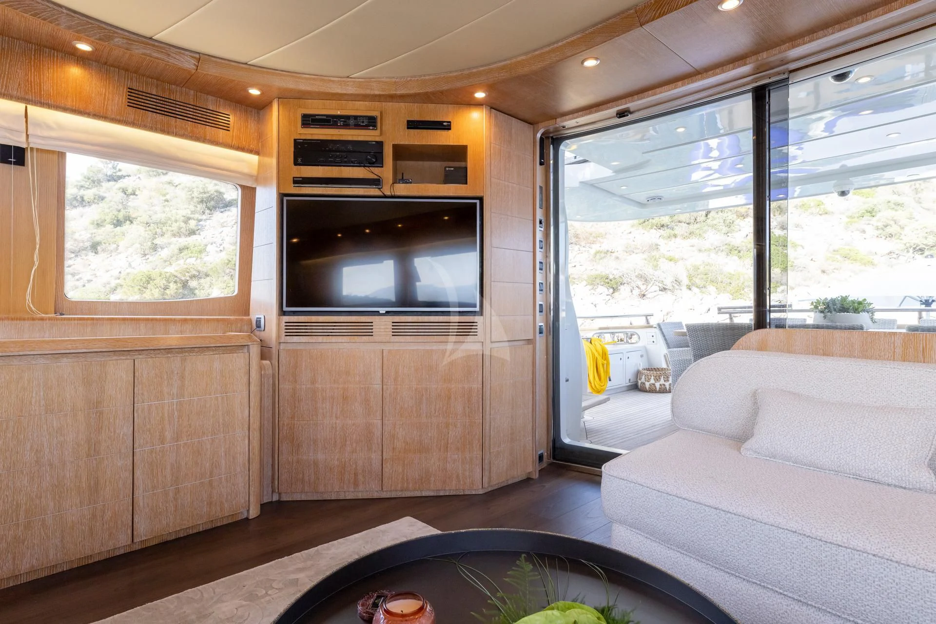 a living room with a large window aboard COOKIE Yacht for Charter
