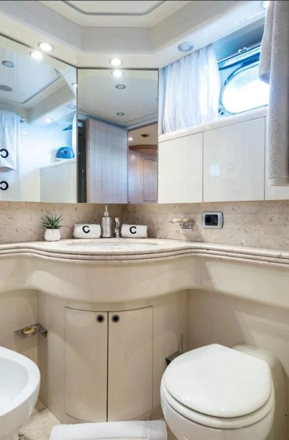 a bathroom with a sink and toilet aboard COOKIE Yacht for Charter