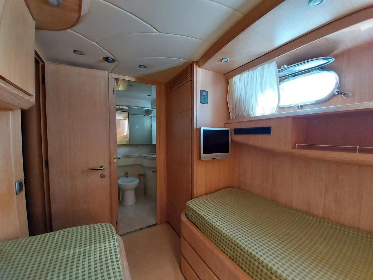 a bathroom with a tv and a toilet aboard COOKIE Yacht for Charter
