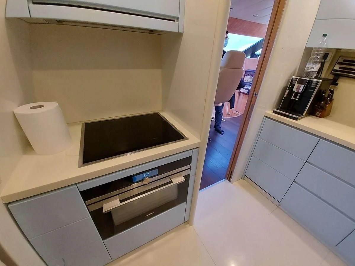 a room with a sink and cabinets aboard COOKIE Yacht for Charter