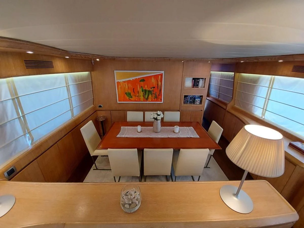 a room with a table and chairs aboard COOKIE Yacht for Charter