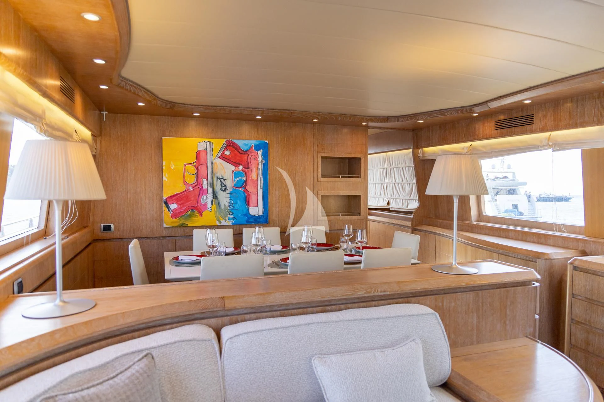 a living room with a large painting aboard COOKIE Yacht for Charter