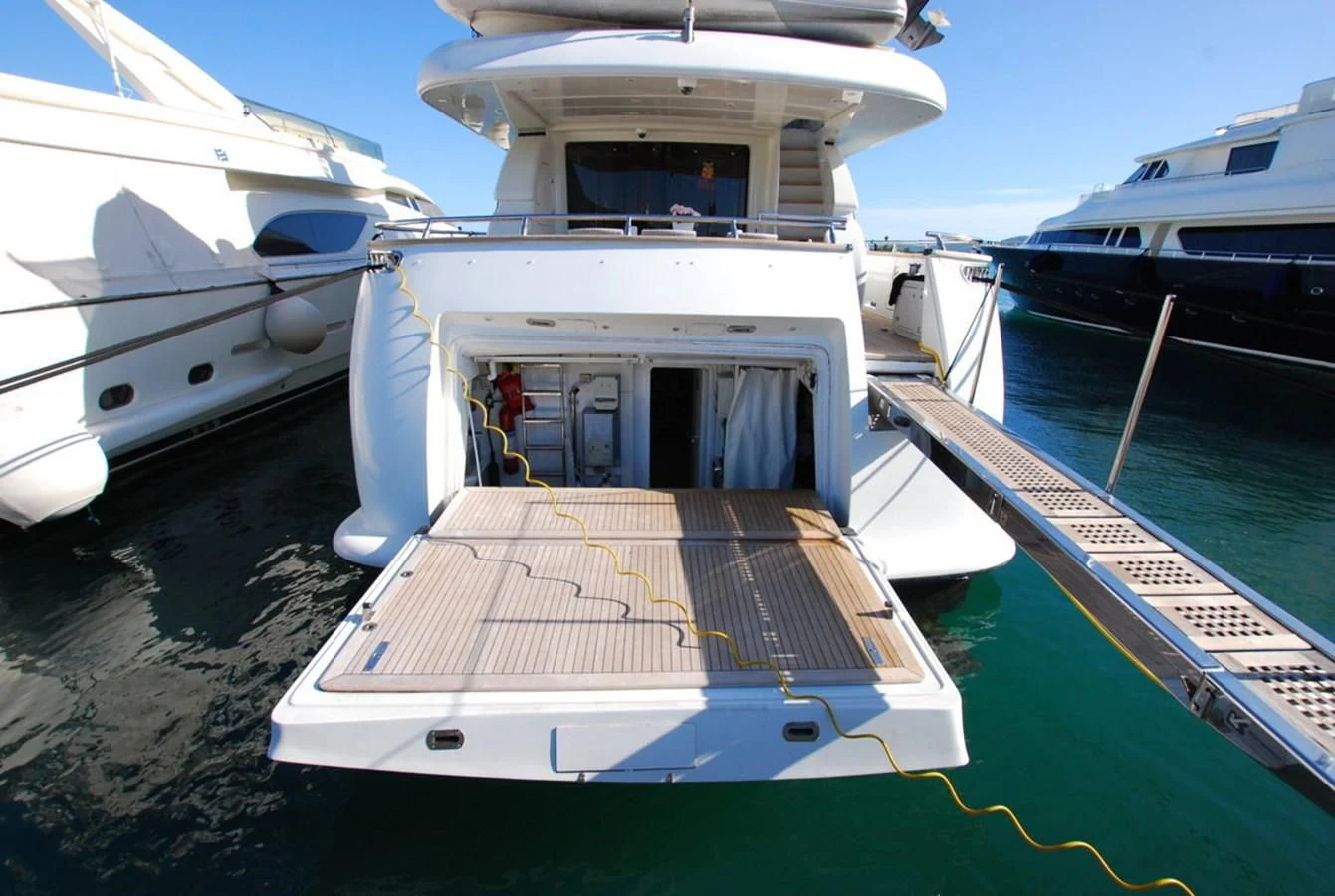 a boat docked at a pier aboard COOKIE Yacht for Charter