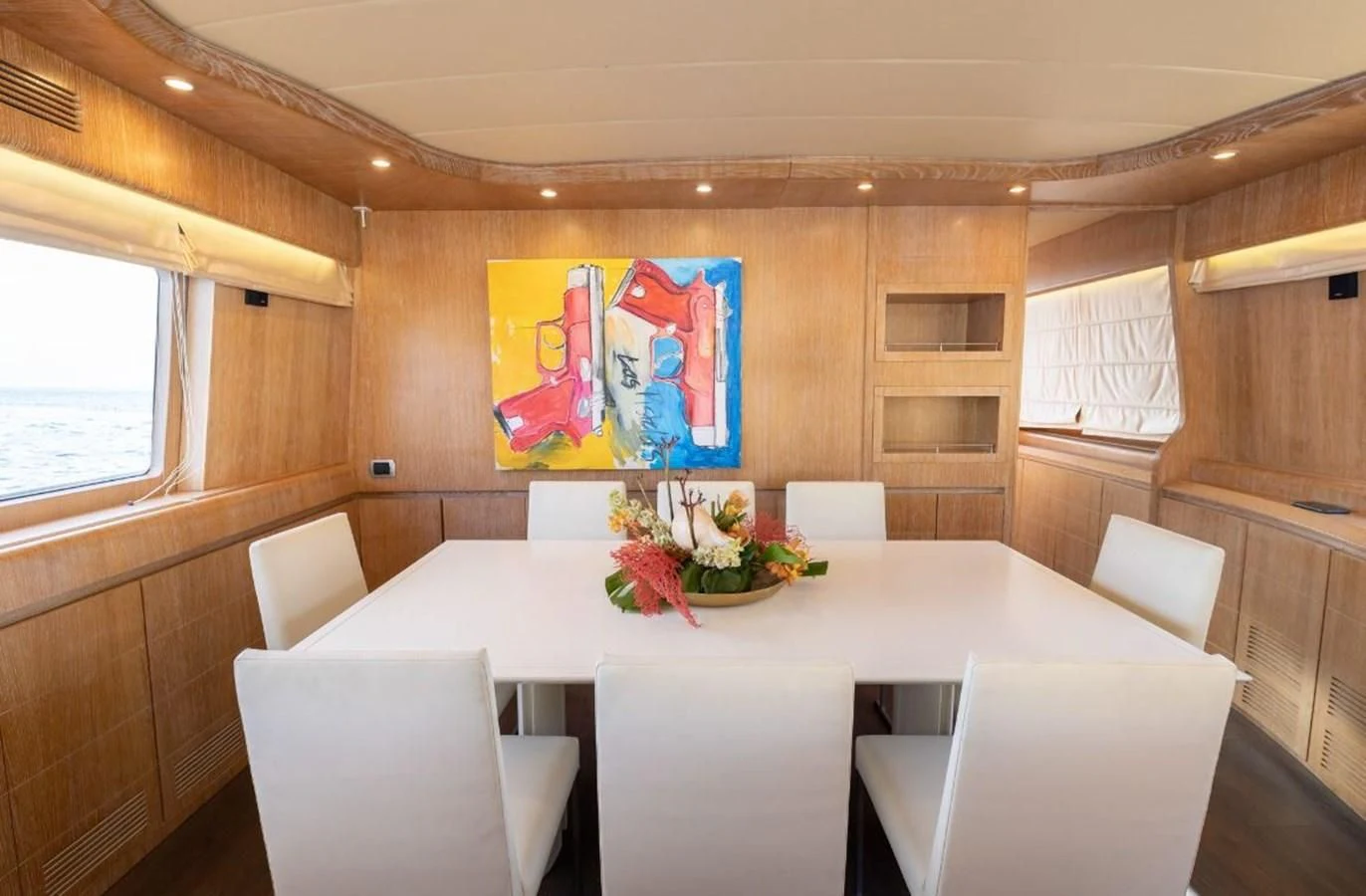 a room with a table and chairs aboard COOKIE Yacht for Charter
