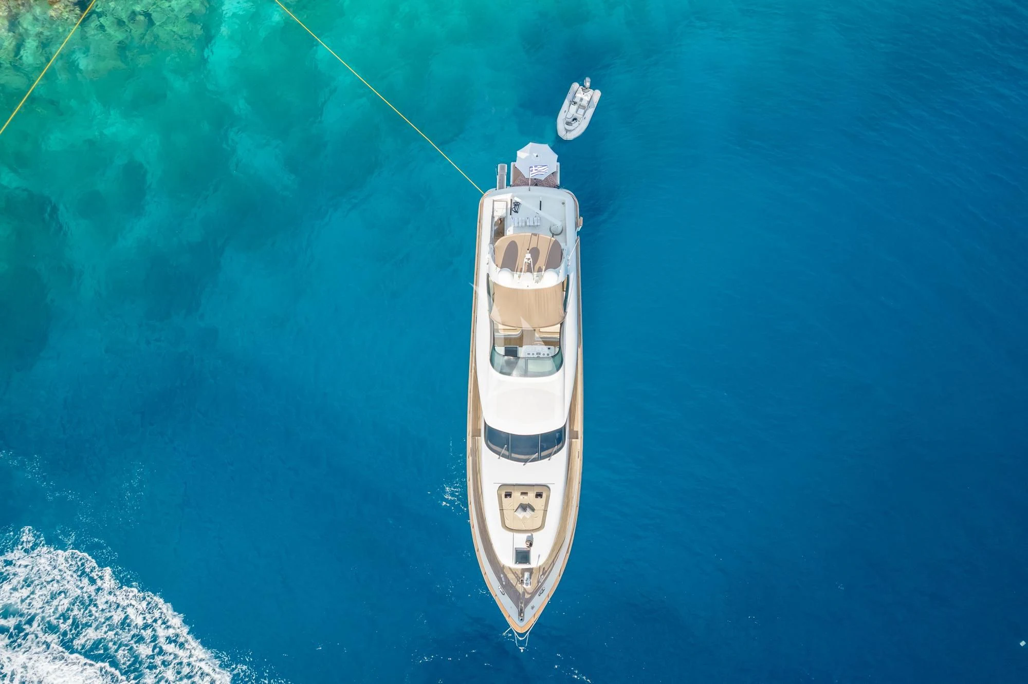 a white and black boat in the water aboard COOKIE Yacht for Charter