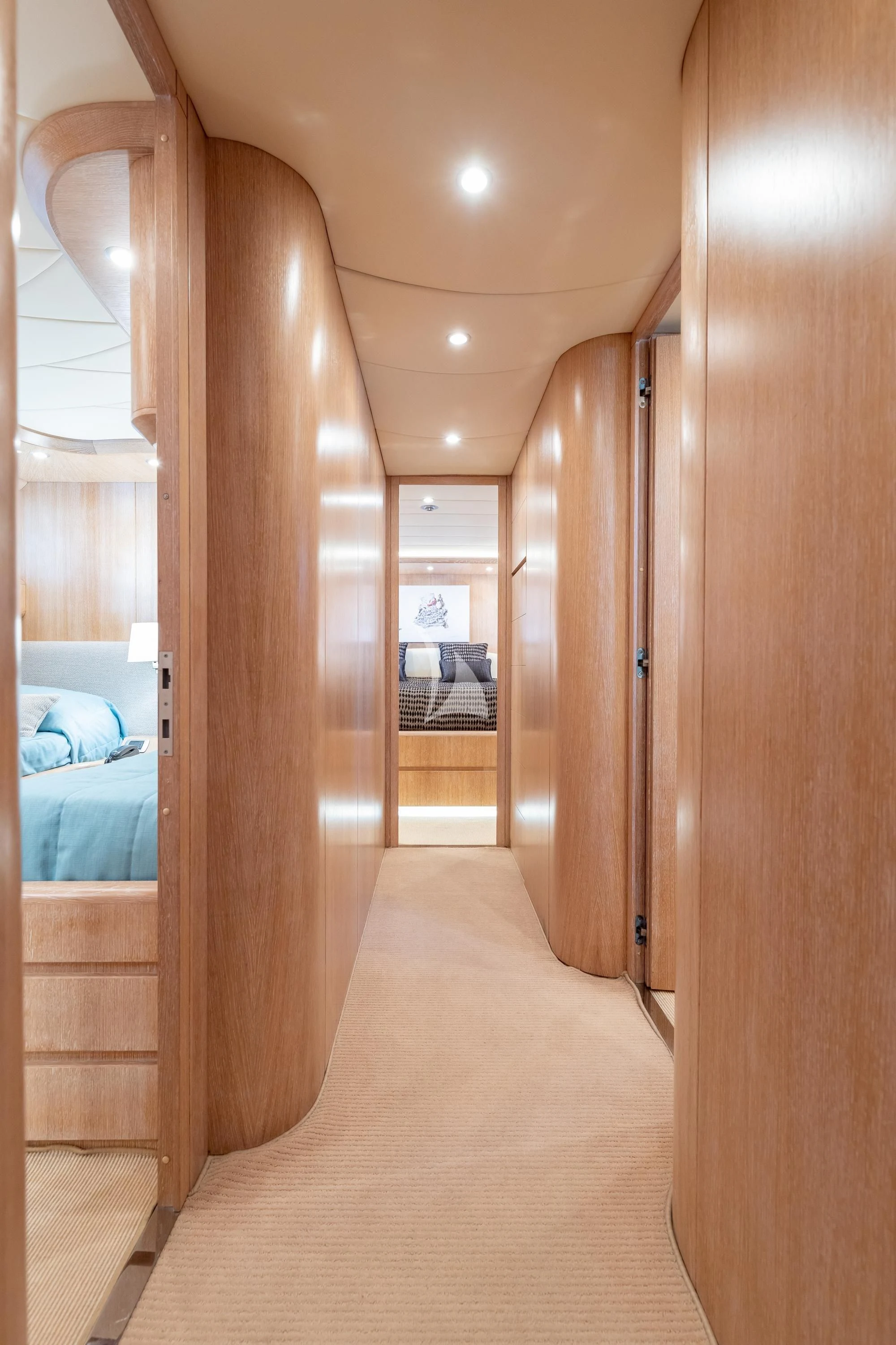 a room with a wood door and a bed aboard COOKIE Yacht for Charter