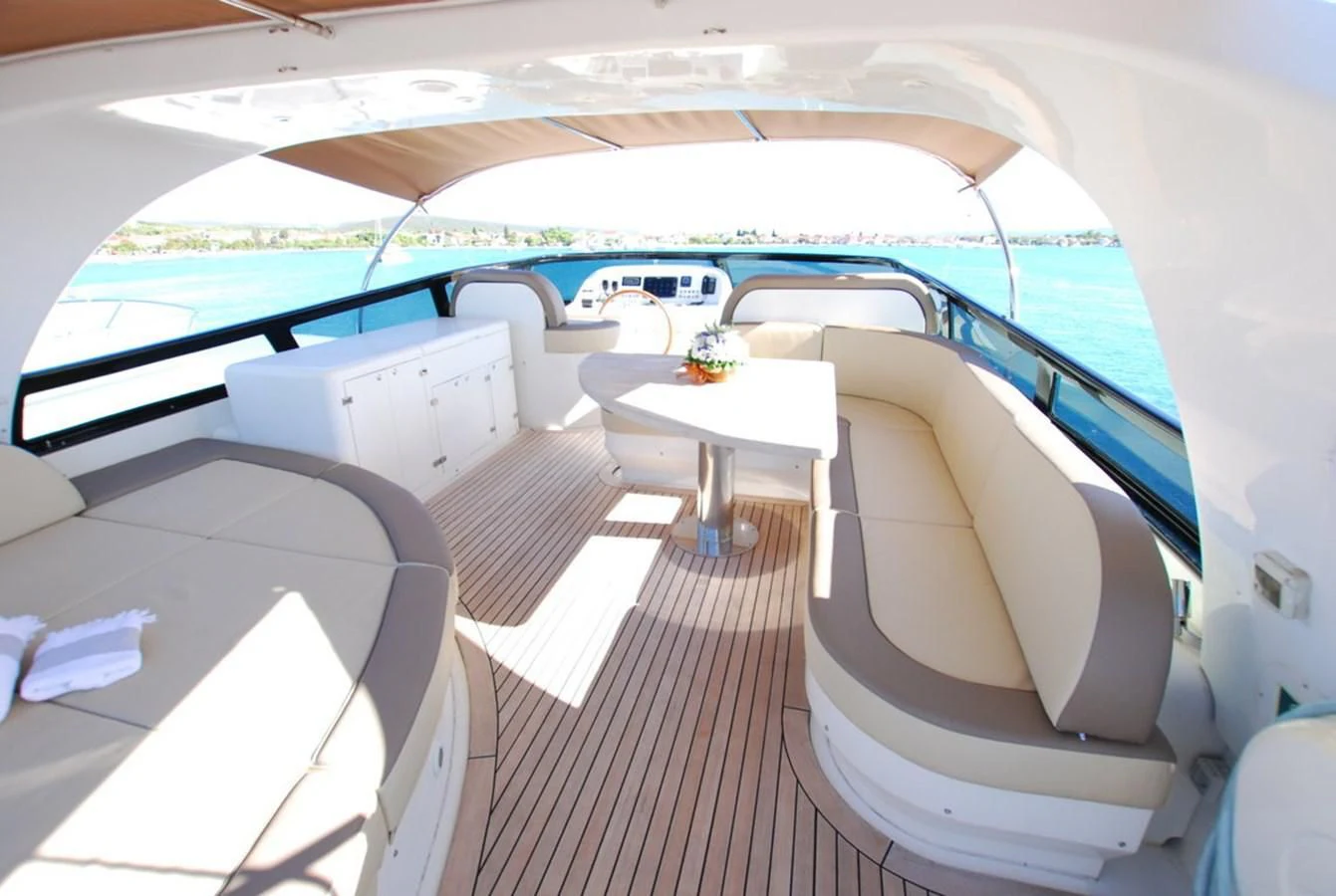 a room with a table and chairs aboard COOKIE Yacht for Charter