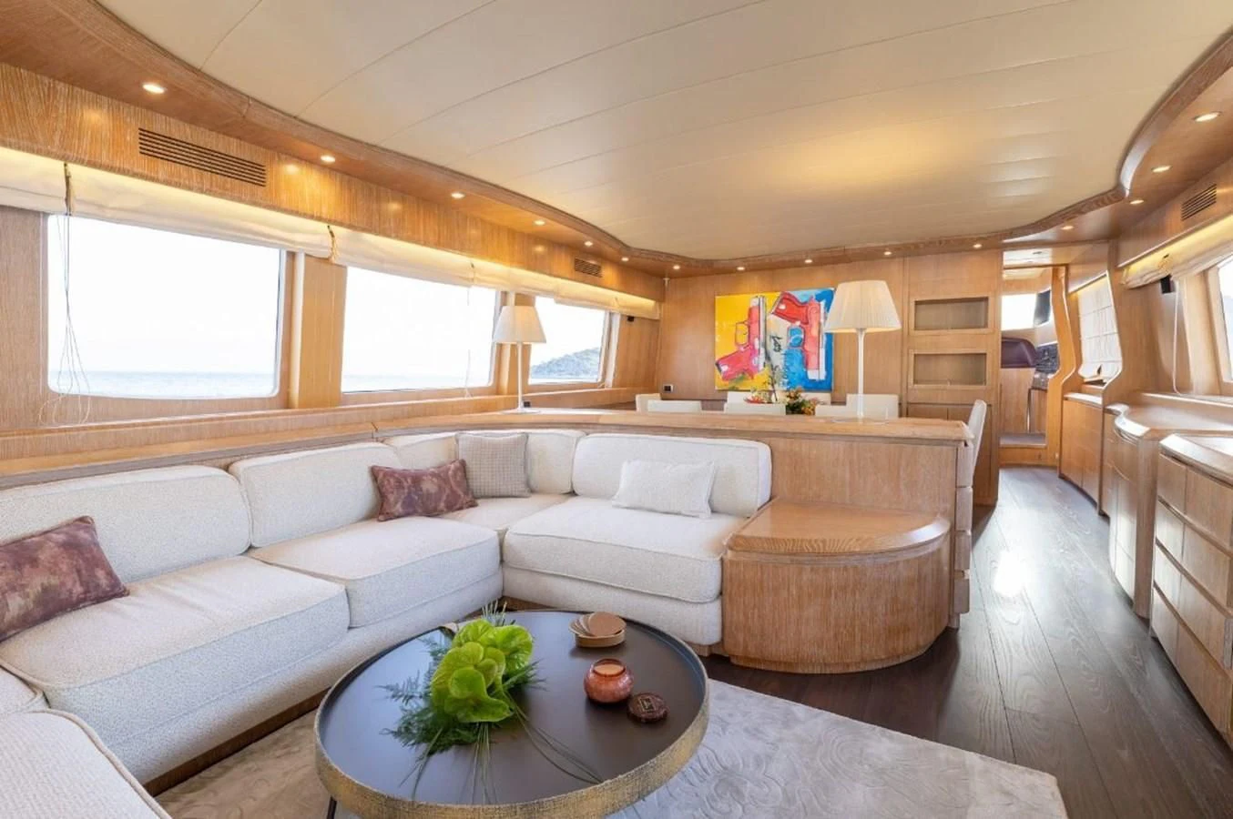 a living room with a couch and a coffee table aboard COOKIE Yacht for Charter