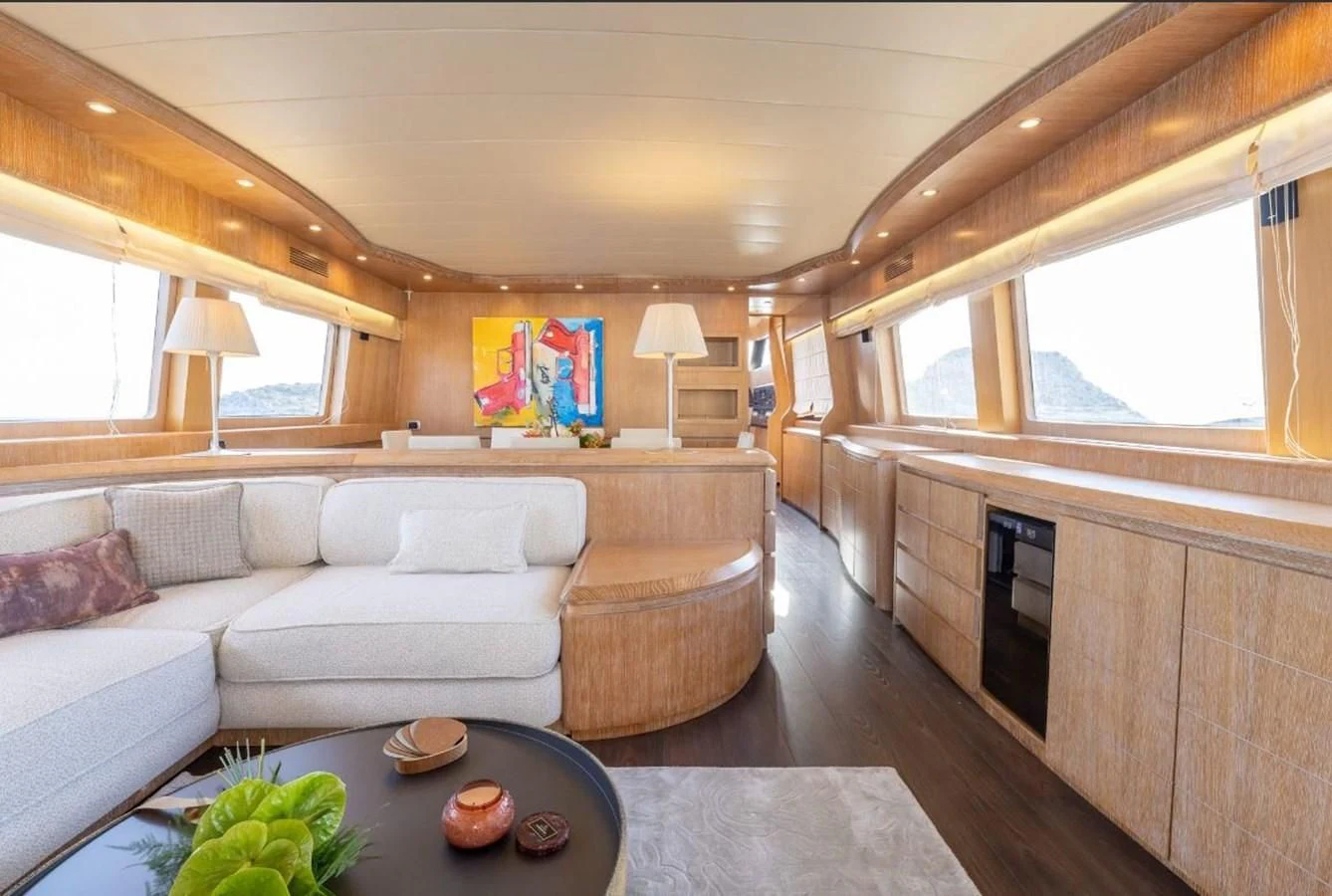 a living room with a couch and a table aboard COOKIE Yacht for Charter