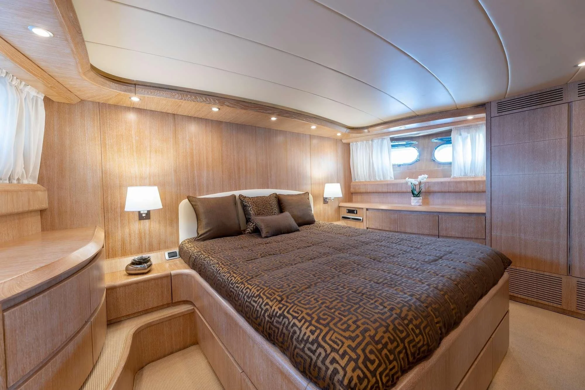 a bedroom with a bed and a desk aboard COOKIE Yacht for Charter