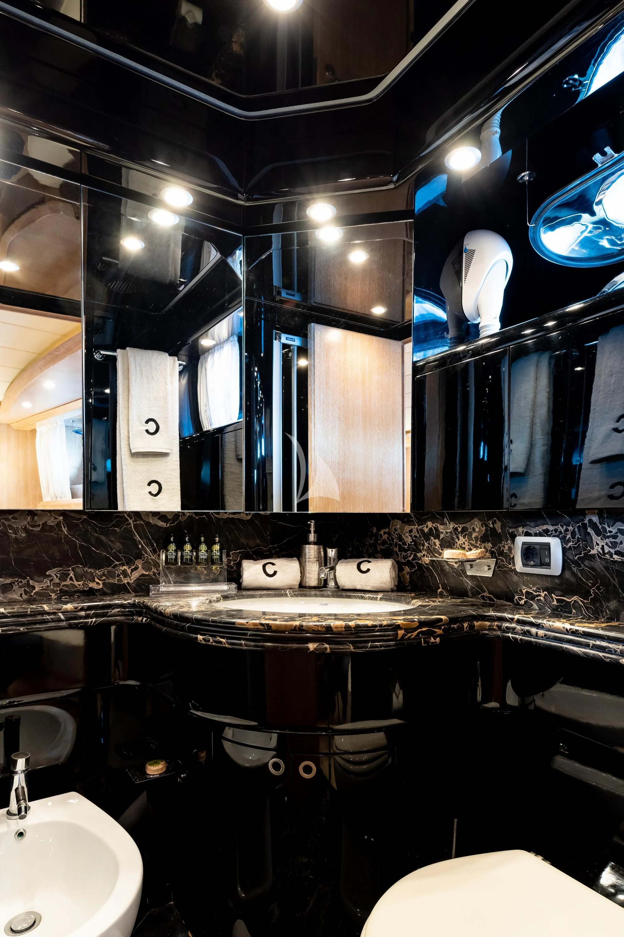 a bathroom with a large mirror aboard COOKIE Yacht for Charter