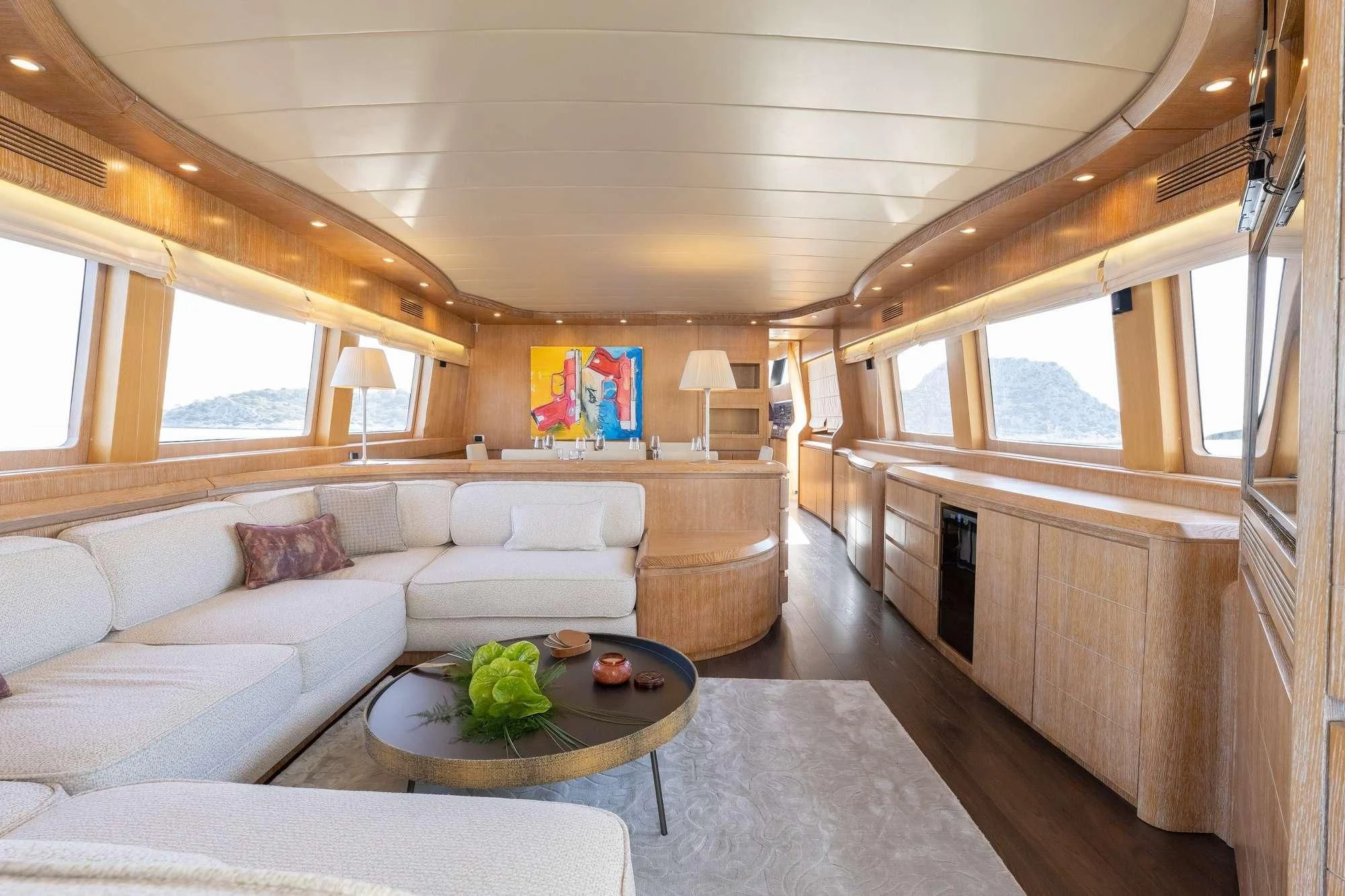 a living room with a couch and a coffee table aboard COOKIE Yacht for Charter