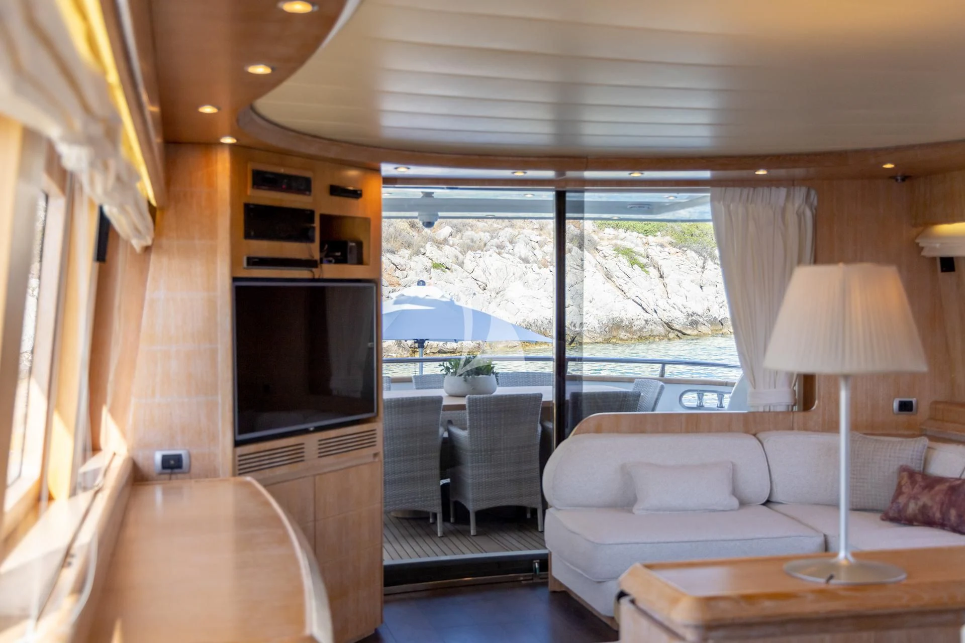 a living room with a couch and a television aboard COOKIE Yacht for Charter