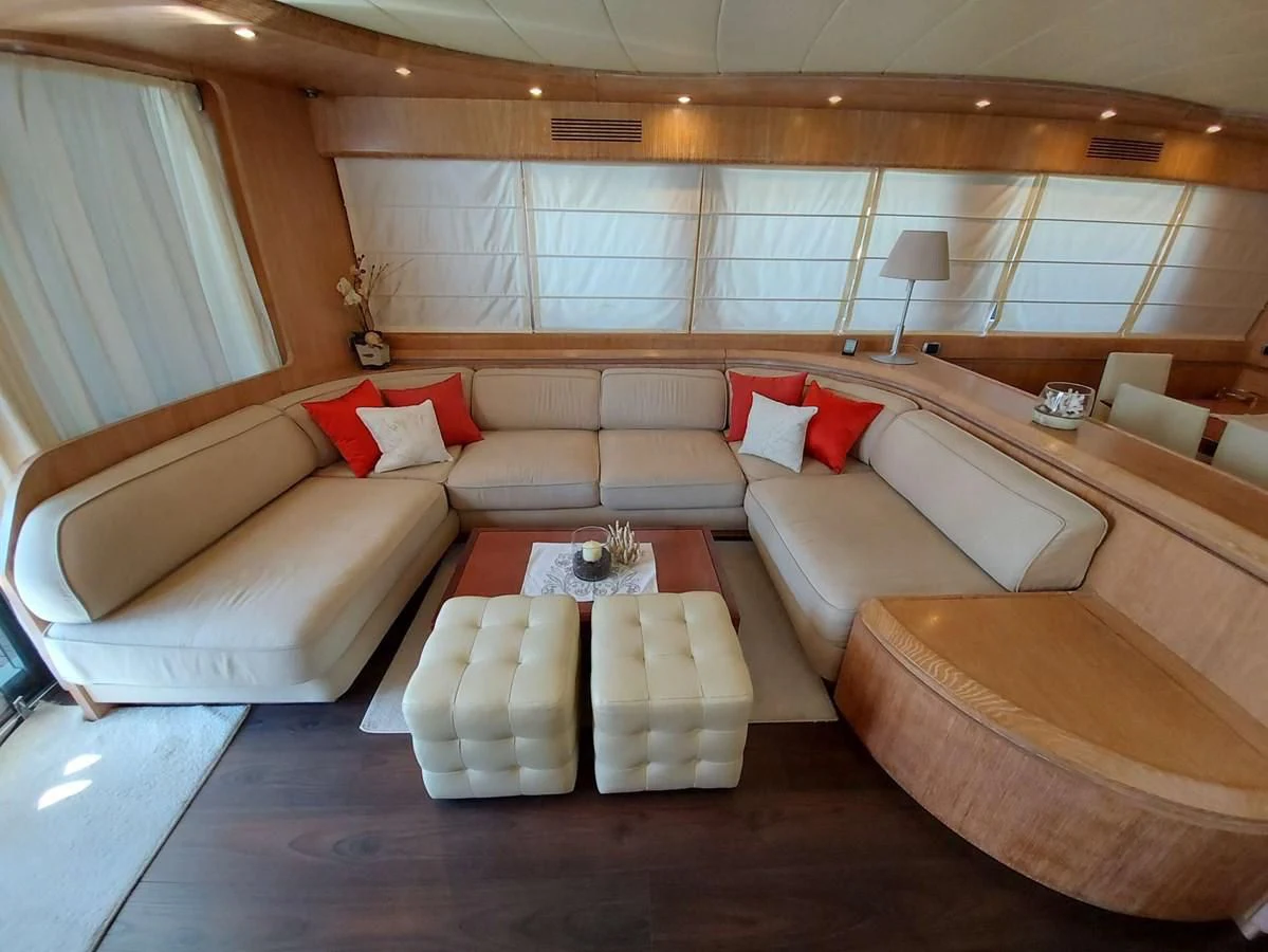 a living room with a couch and a table aboard COOKIE Yacht for Charter