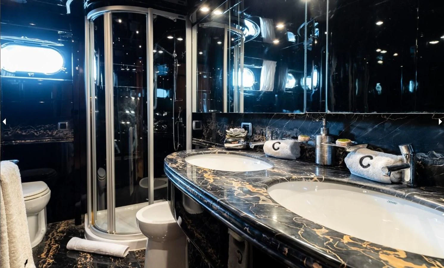 a bathroom with a glass shower aboard COOKIE Yacht for Charter