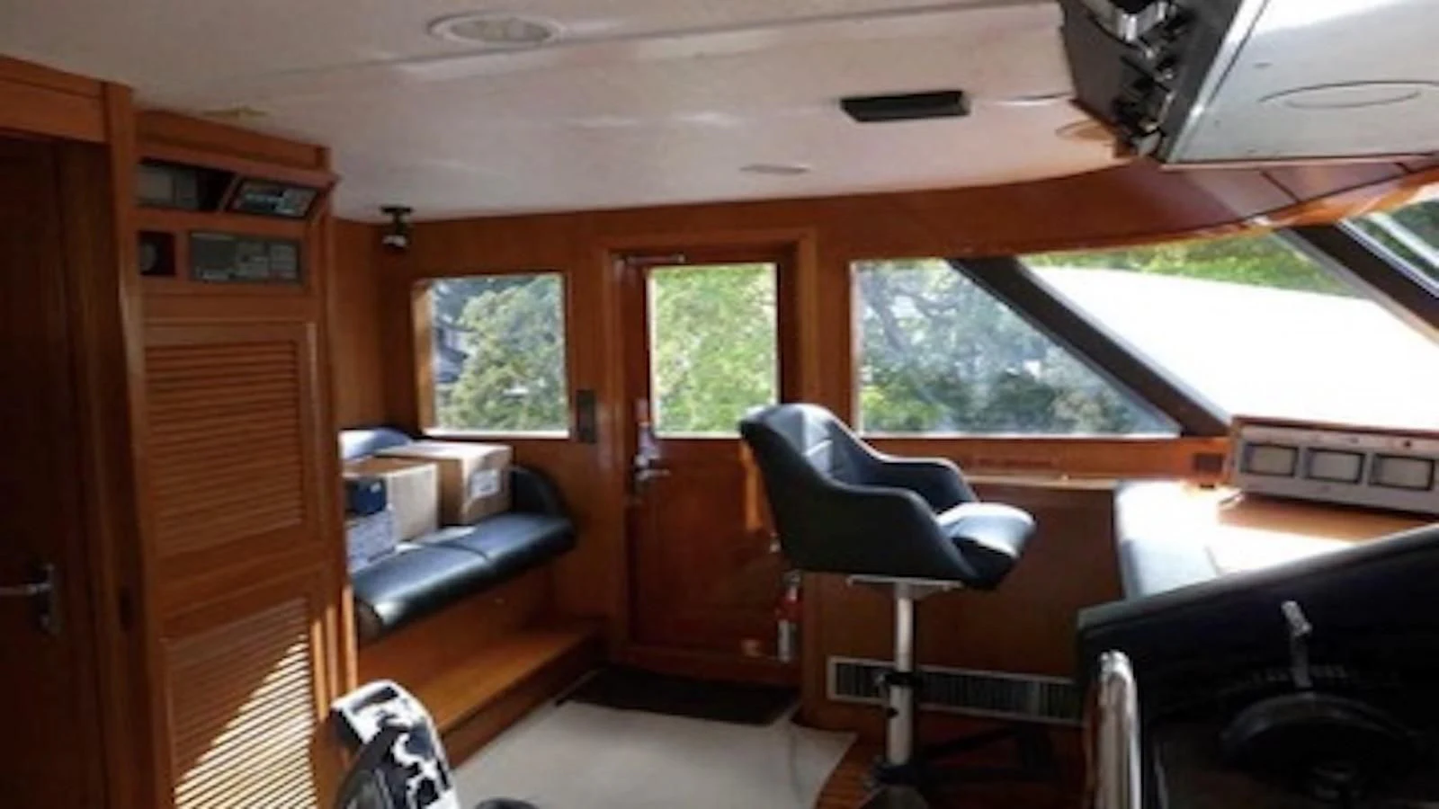 a room with a couch and a table and a chair aboard SEAGULL OF CAYMAN Yacht for Sale