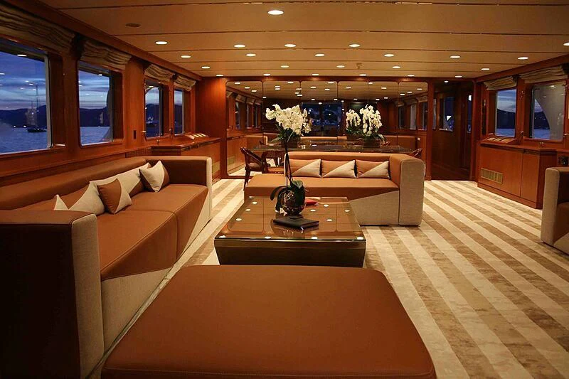 a living room with a couch and a coffee table aboard SEAGULL OF CAYMAN Yacht for Sale