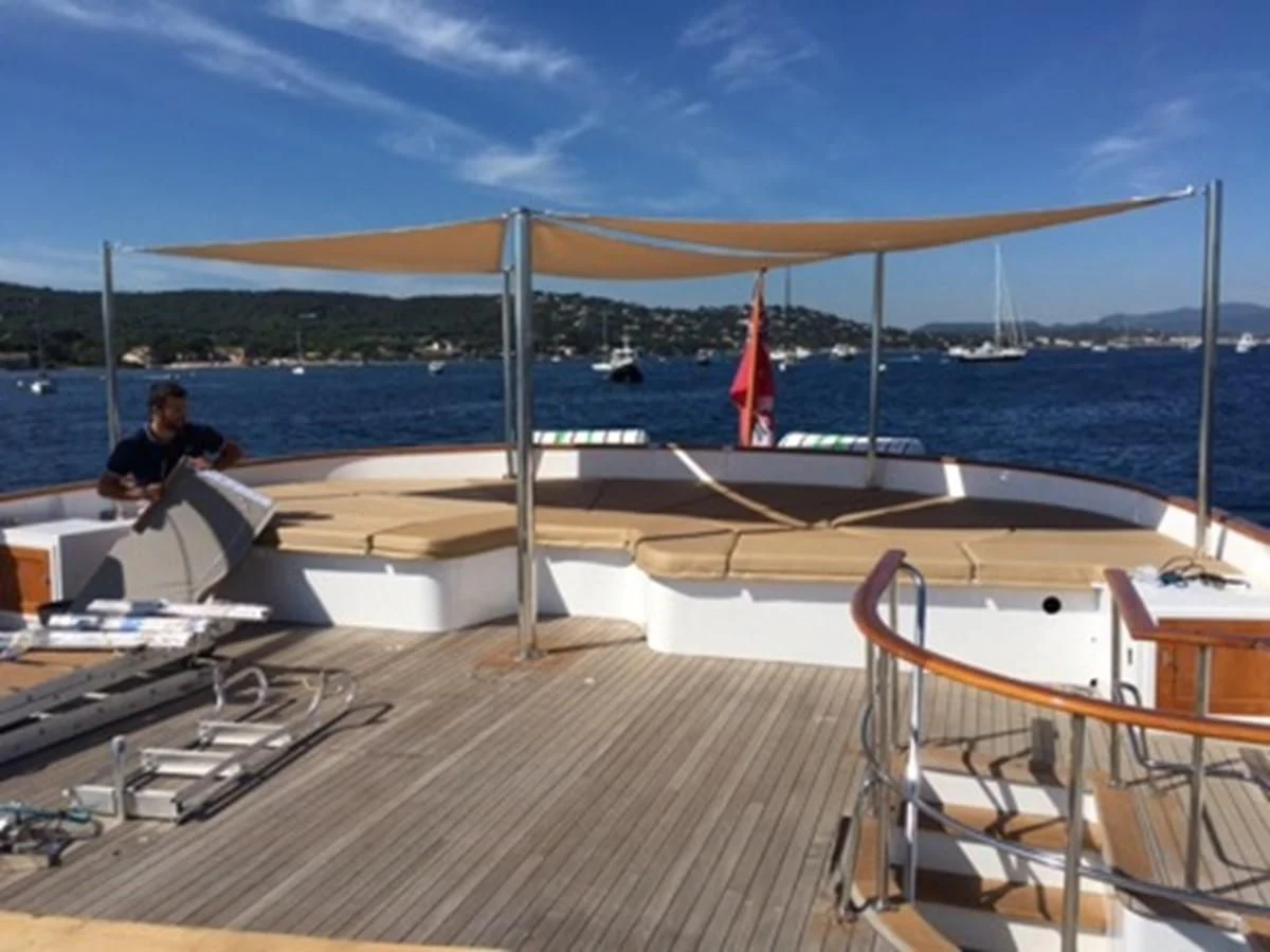 a person sitting on a boat aboard SEAGULL OF CAYMAN Yacht for Sale