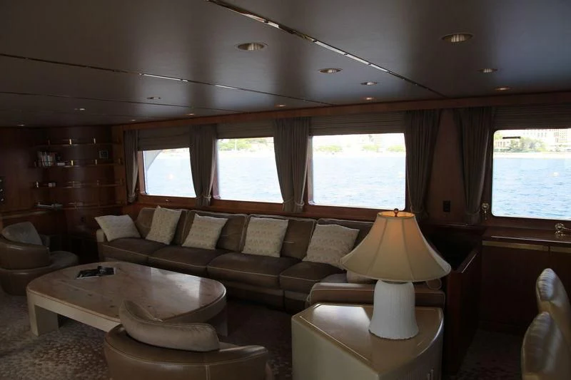 a living room with a couch and a table aboard SEAGULL OF CAYMAN Yacht for Sale