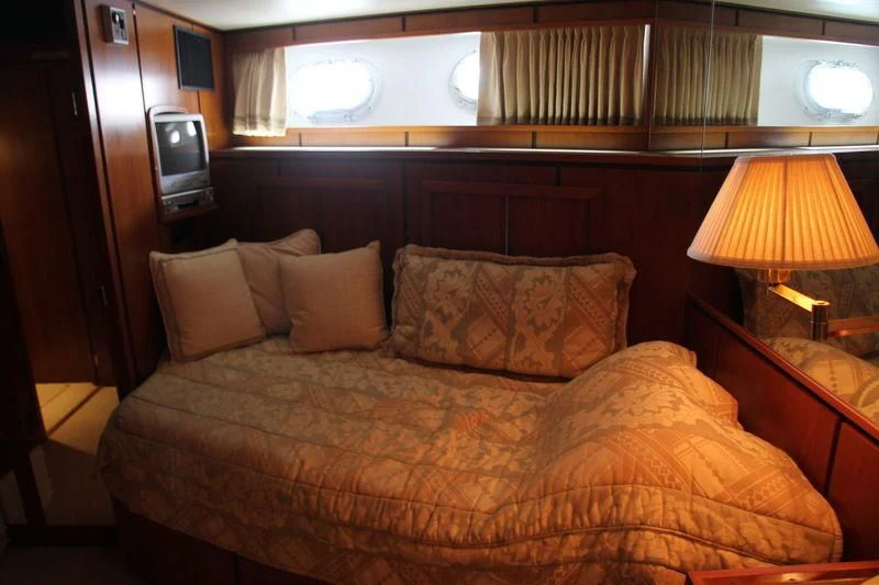 a bed with pillows aboard SEAGULL OF CAYMAN Yacht for Sale