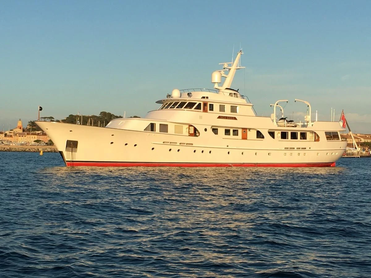 a large white boat in the water aboard SEAGULL OF CAYMAN Yacht for Sale