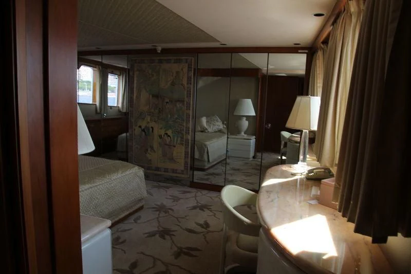 a room with a bed and a desk aboard SEAGULL OF CAYMAN Yacht for Sale