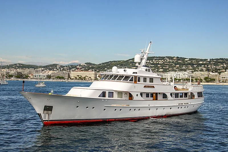 a large white boat in the water aboard SEAGULL OF CAYMAN Yacht for Sale