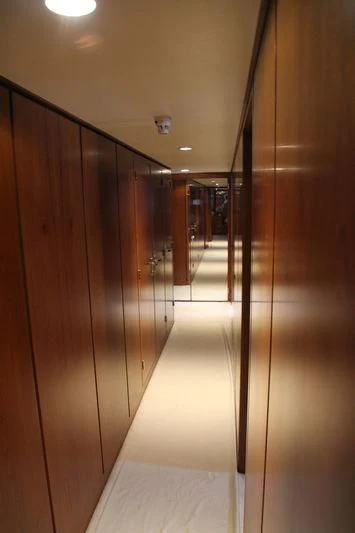 a hallway with glass doors aboard SEAGULL OF CAYMAN Yacht for Sale